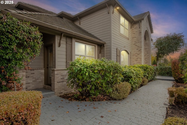 view of property exterior at dusk