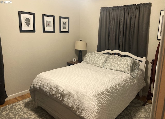 bedroom with wood-type flooring