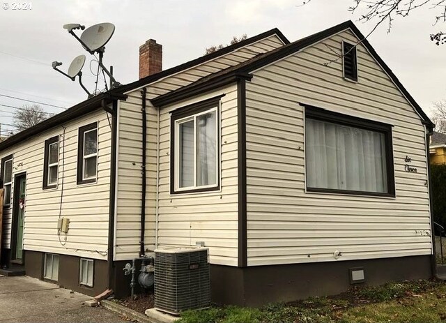 view of property exterior featuring central AC