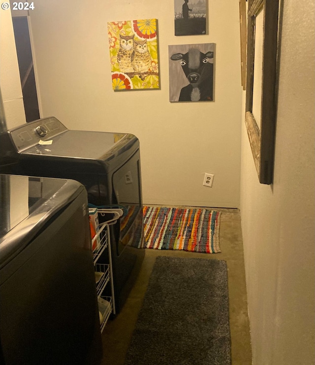 laundry area with independent washer and dryer