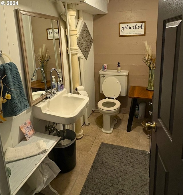 bathroom with sink, tile patterned floors, and toilet