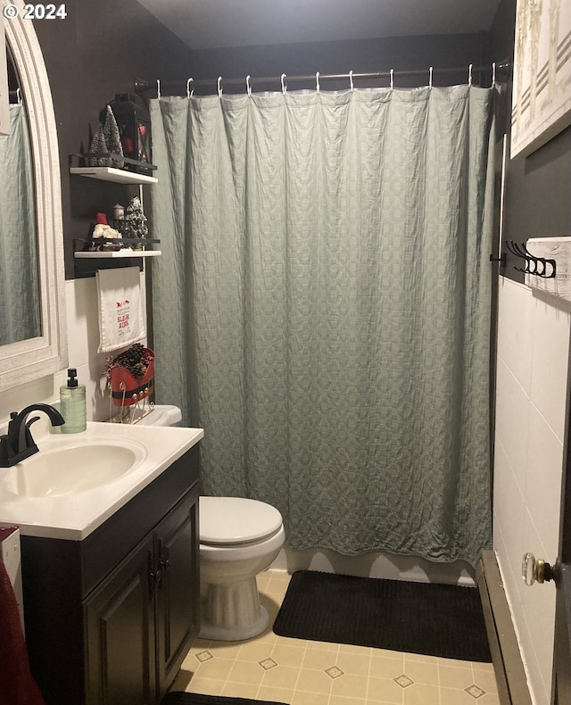 bathroom with tile walls, tile patterned flooring, vanity, toilet, and a shower with curtain