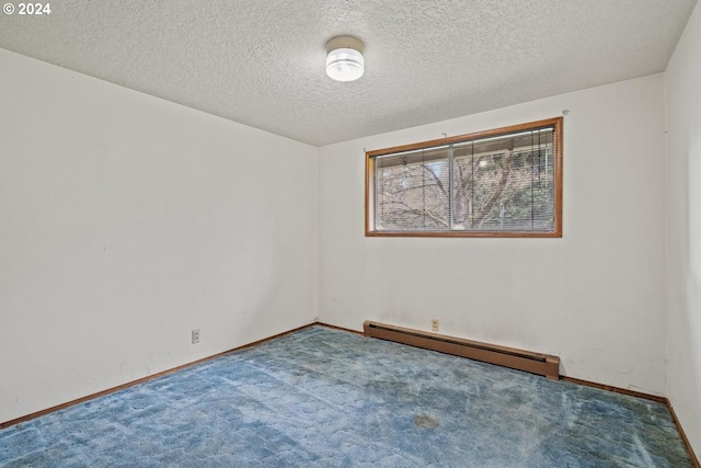 carpeted empty room featuring a textured ceiling and baseboard heating