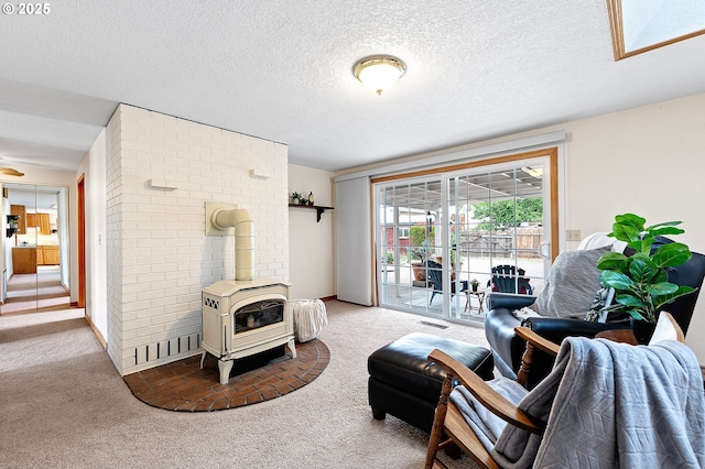 970 Kalmia St, Junction City, OR 97448 - carpeted living area with a wood stove and a textured ceiling