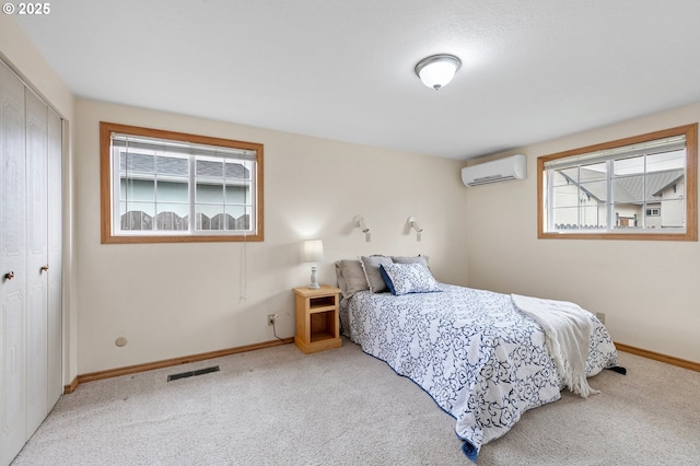 970 Kalmia St, Junction City, OR 97448 - carpeted bedroom featuring a wall unit AC and a closet