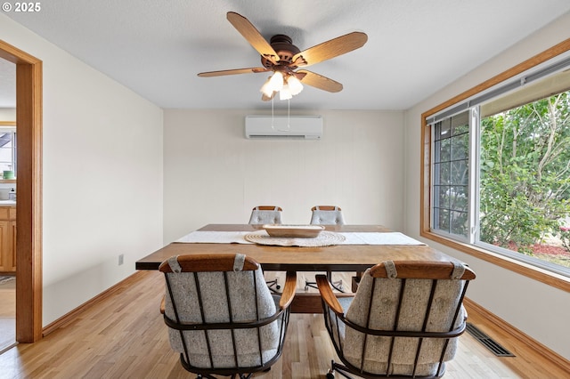 970 Kalmia St, Junction City, OR 97448 - dining space with a wall unit AC, plenty of natural light, and light wood-style flooring