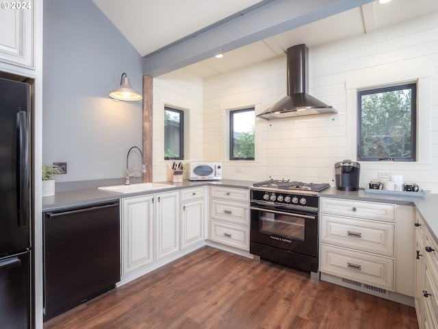 kitchen with wall chimney exhaust hood, black appliances, a healthy amount of sunlight, and dark hardwood / wood-style floors