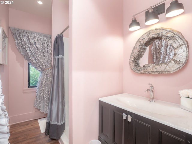 bathroom featuring vanity and hardwood / wood-style floors