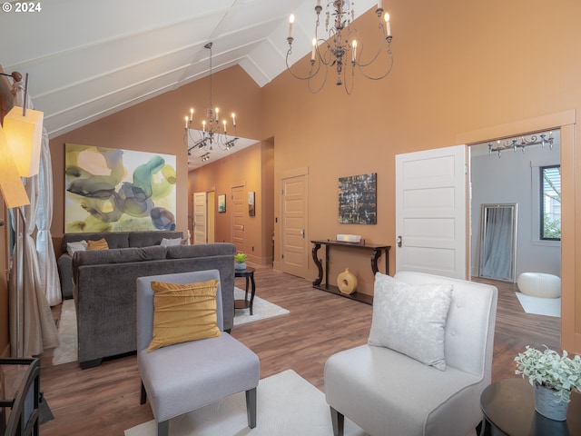 living room featuring lofted ceiling, dark wood-type flooring, and a chandelier