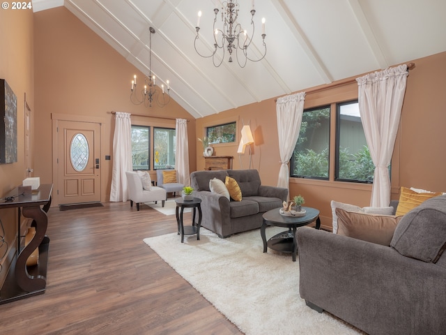 living room with dark hardwood / wood-style flooring, beamed ceiling, high vaulted ceiling, and a chandelier