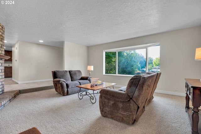 living room with a textured ceiling, light colored carpet, and a fireplace