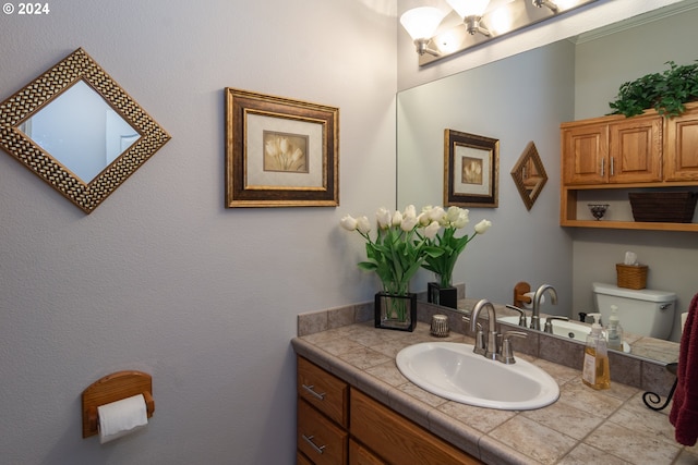 half bathroom featuring toilet and vanity