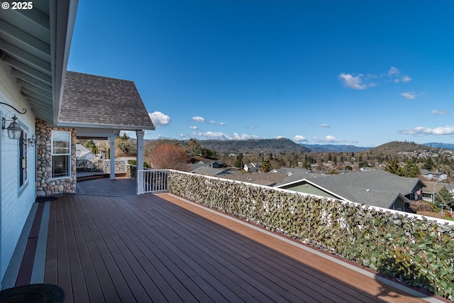 wooden deck with a mountain view