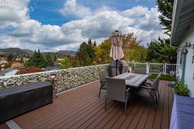 wooden terrace featuring a mountain view