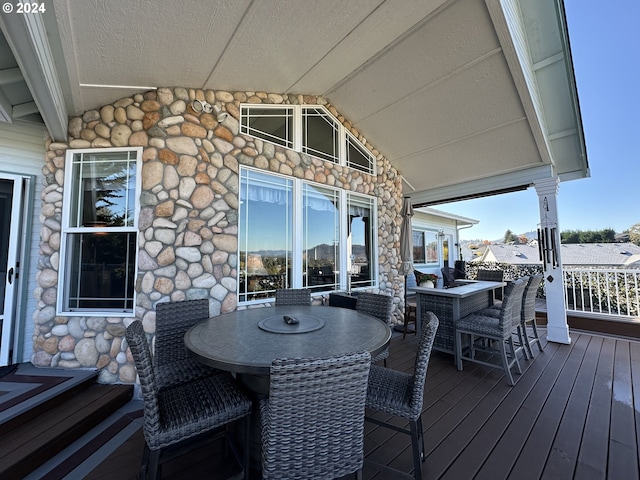 deck featuring outdoor dining area