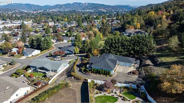 birds eye view of property with a mountain view and a residential view