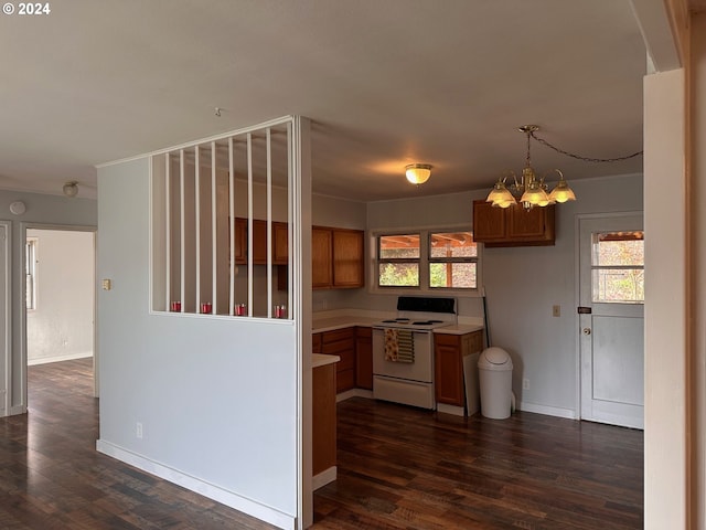 1106 N Myrtle Rd, Myrtle Creek, OR 97457 - kitchen featuring white electric range, a chandelier, light countertops, brown cabinets, and dark wood-style flooring