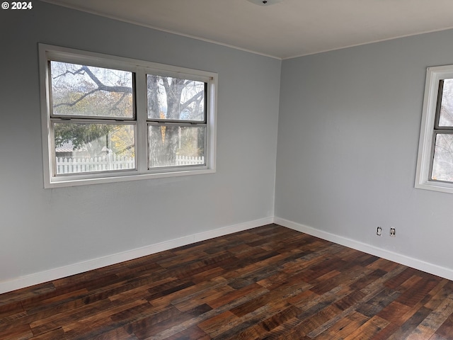 1106 N Myrtle Rd, Myrtle Creek, OR 97457 - spare room featuring crown molding and dark wood-style flooring