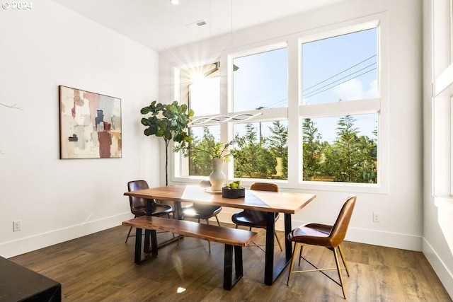 dining area with dark wood-type flooring