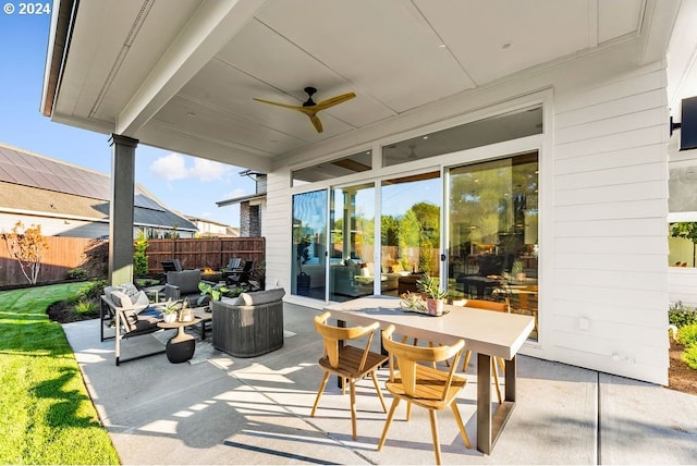 view of terrace with outdoor lounge area and ceiling fan