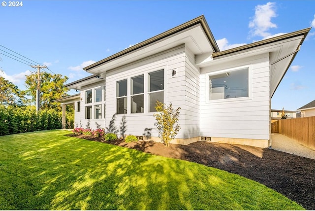 rear view of house with a yard