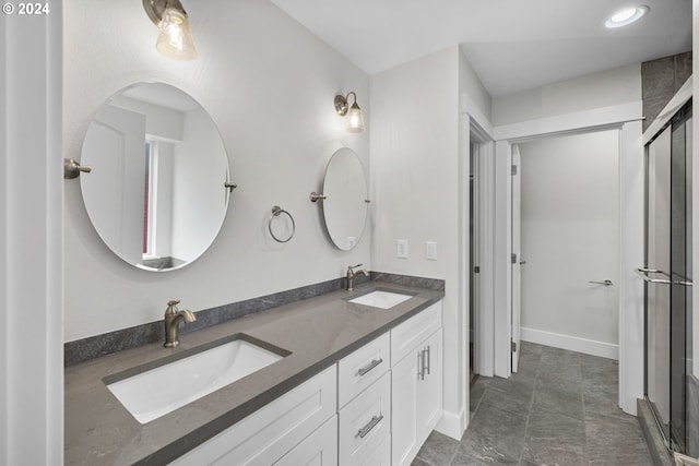 bathroom with vanity and an enclosed shower