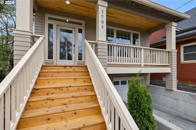 view of exterior entry with a porch