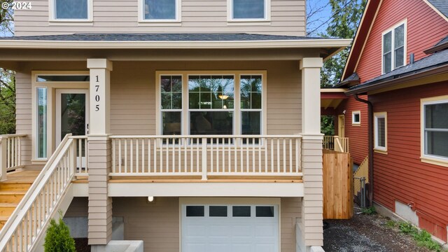 rear view of house with a garage