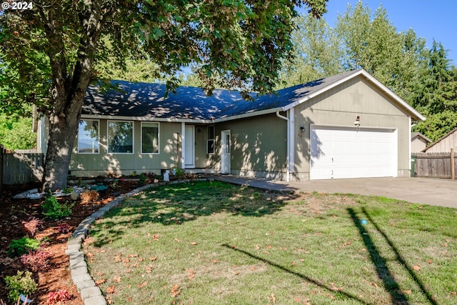 ranch-style home with a front yard and a garage