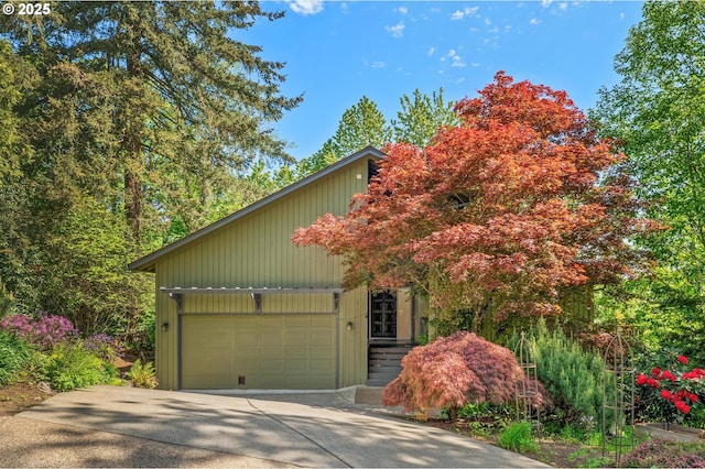 view of front of property featuring an attached garage and driveway