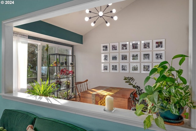 interior space with a notable chandelier and vaulted ceiling