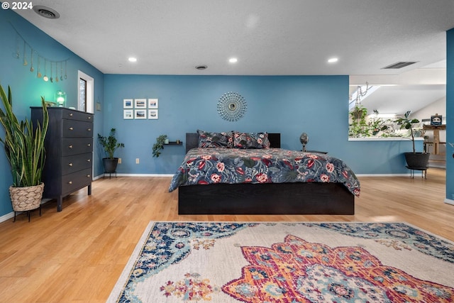 bedroom with light hardwood / wood-style floors