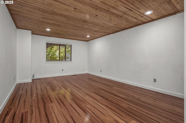 empty room with wood ceiling, baseboards, recessed lighting, and wood finished floors