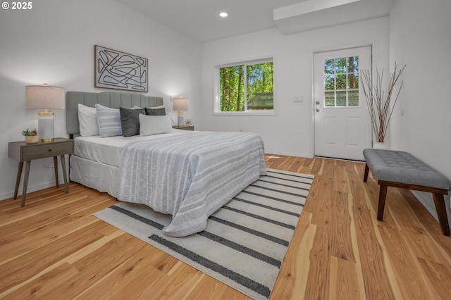 bedroom with light wood-style floors, recessed lighting, and baseboards