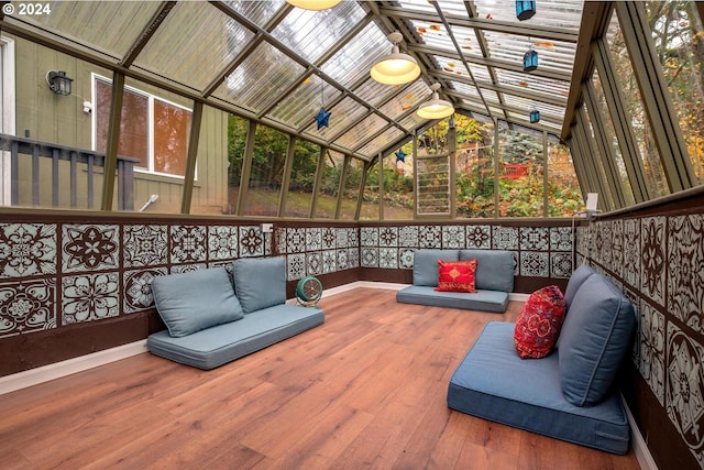 sunroom / solarium featuring plenty of natural light and lofted ceiling