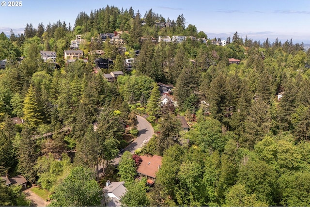 aerial view featuring a view of trees