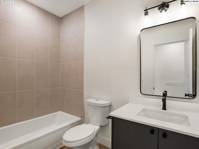 full bathroom with vanity, toilet, and tiled shower / bath combo