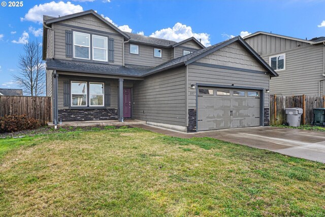 view of front facade featuring a garage and a front yard