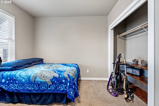 carpeted bedroom featuring a closet