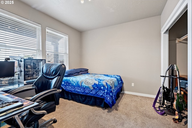 carpeted bedroom with baseboards