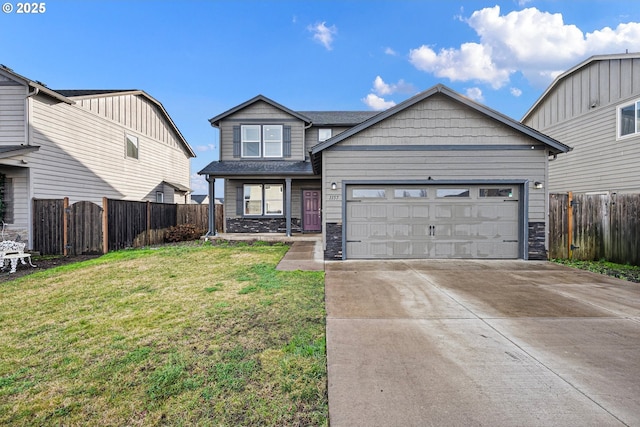 view of front of property with a garage and a front lawn