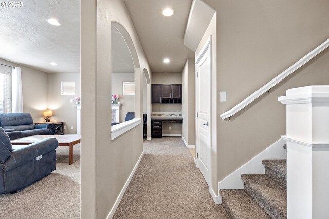 hallway with light carpet