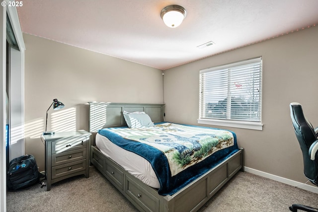 bedroom featuring light carpet, visible vents, and baseboards