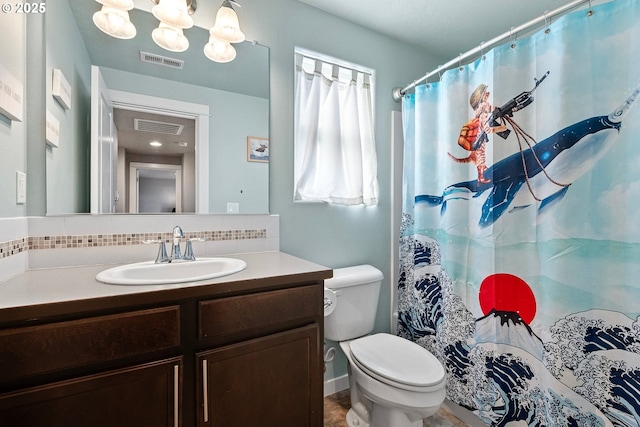 bathroom with vanity, walk in shower, backsplash, and toilet