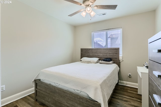 bedroom featuring ceiling fan and dark wood-type flooring