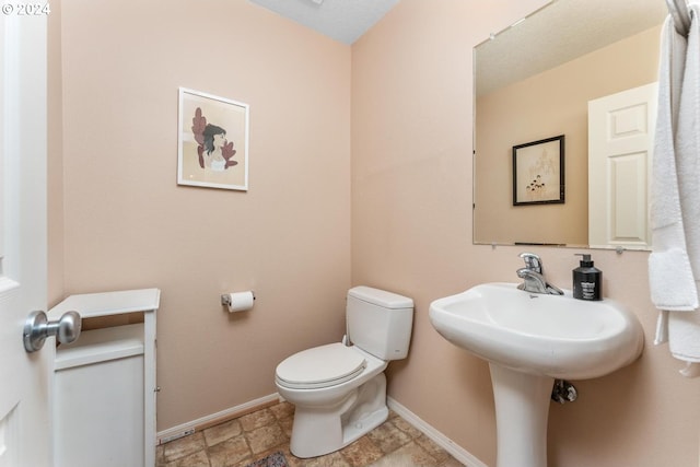 bathroom featuring toilet