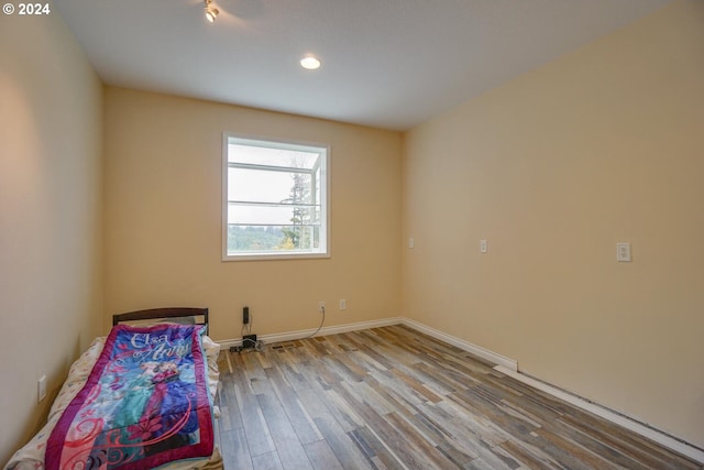 unfurnished bedroom with light hardwood / wood-style floors