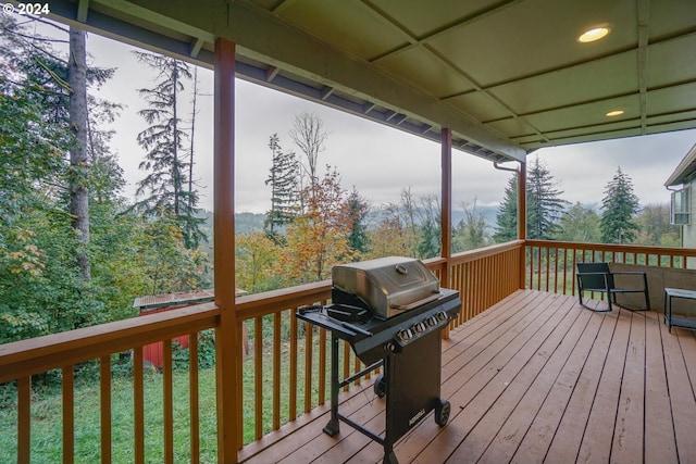 wooden terrace featuring area for grilling