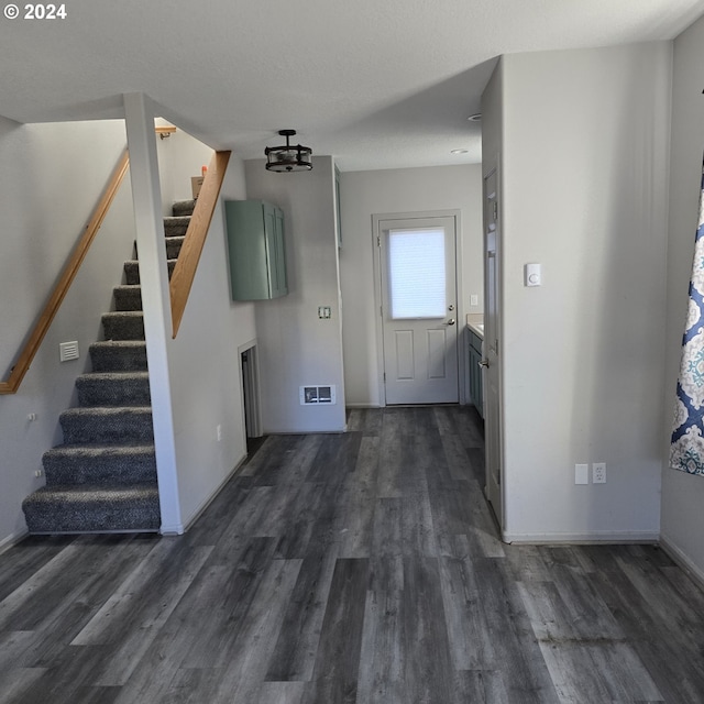 entrance foyer featuring dark wood-type flooring