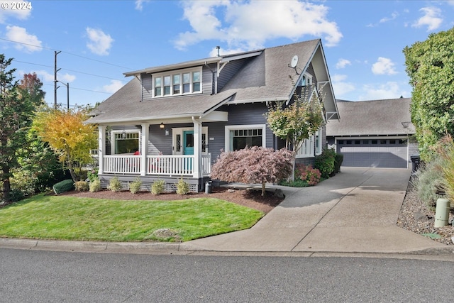 craftsman-style house with covered porch, concrete driveway, a front lawn, and roof with shingles